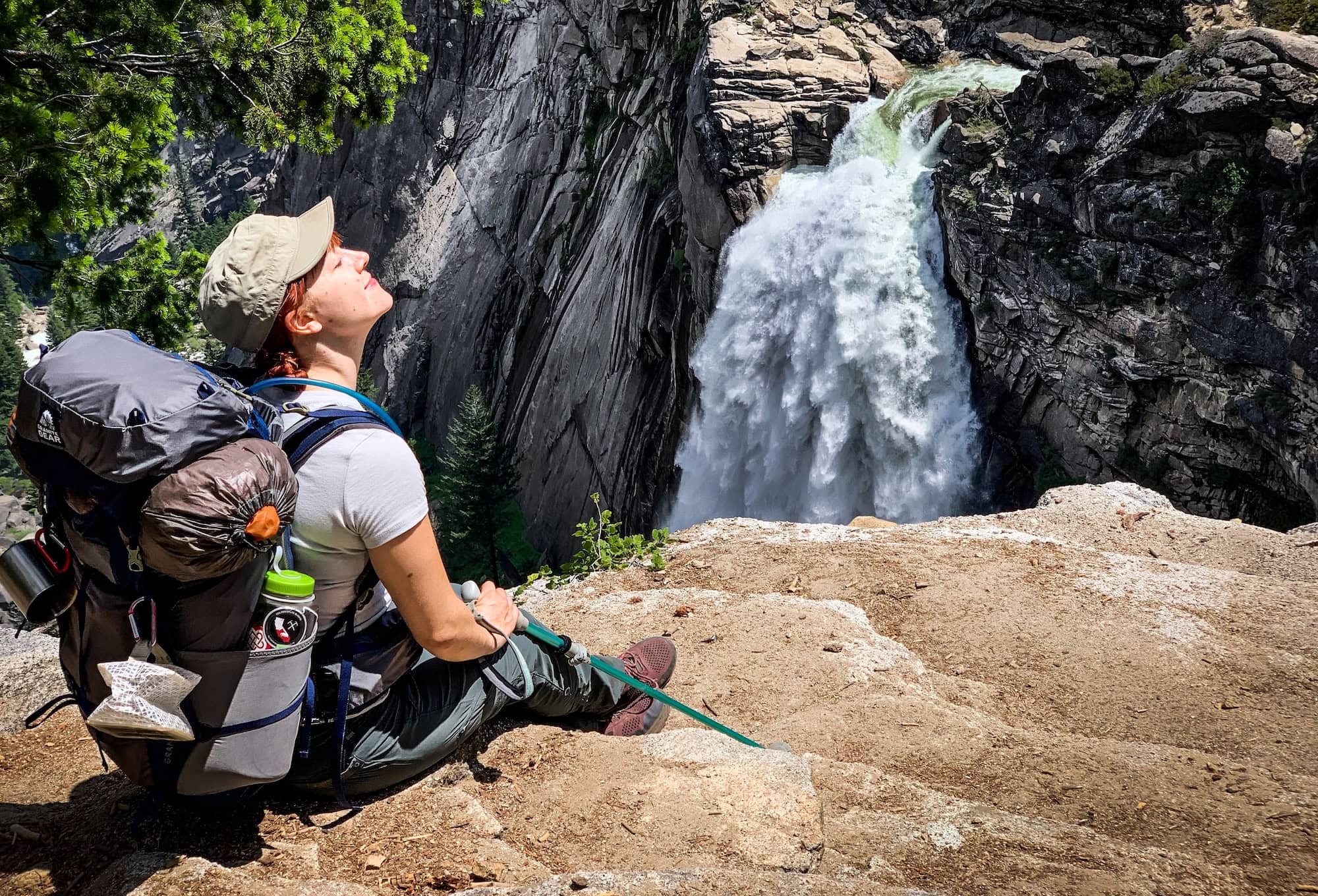 Emily sitting at Illilouette Falls enjoying the sunshine