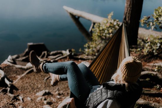 a girl sitting in a hammock